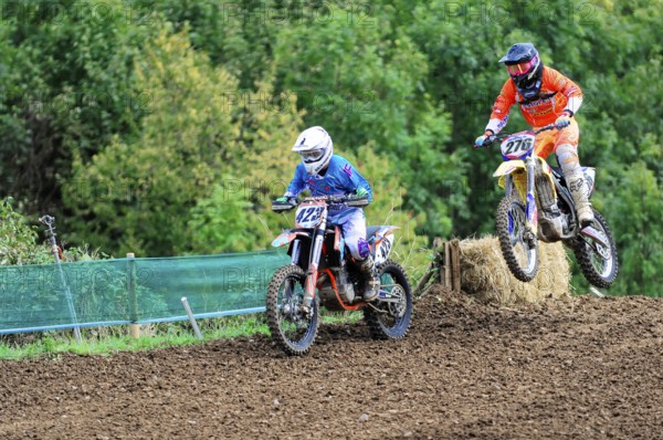 Motocross, Rudersberg, Baden-Württemberg, Germany, Europe, Two motocross riders during a jump over