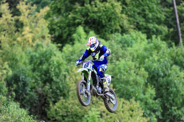 Motocross, Rudersberg, Baden-Württemberg, Germany, Europe, A motocross rider lifts off the ground