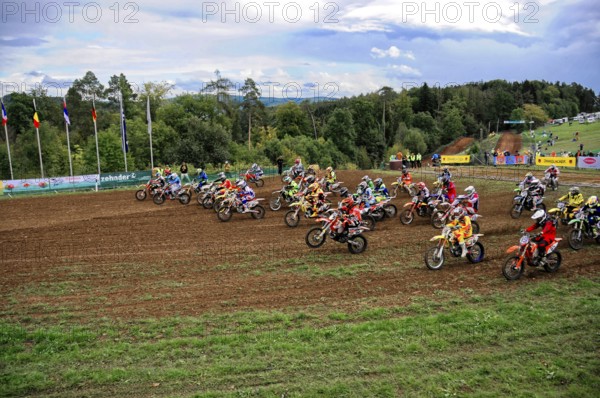 Motocross, Rudersberg, Baden-Württemberg, Germany, Europe, Motocross riders accelerate after the