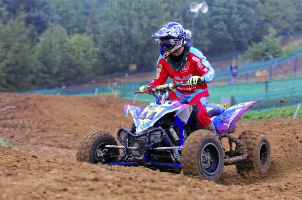 Motocross, Rudersberg, Baden-Württemberg, Germany, Europe, Quad rider in red outfit on a muddy race