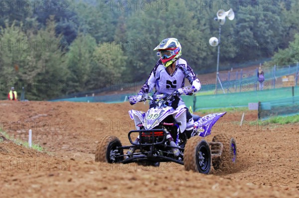 Motocross, Rudersberg, Baden-Württemberg, Germany, Europe, Quad bikers in purple colours on a race