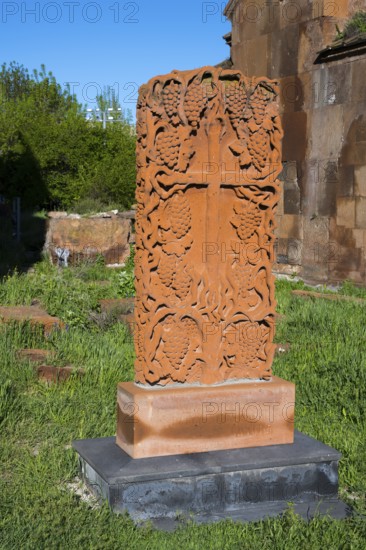 Decorated stone with cross motif in green surroundings, cross stone, Khachkar, Marmashen Monastery,