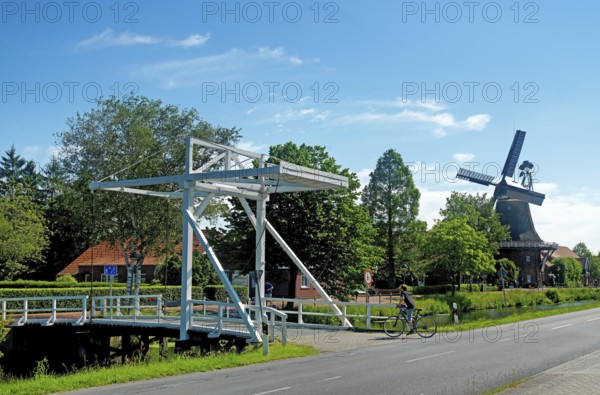 East Frisian bascule bridge, cyclist, gallery bridge, Großefehn, East Frisia, Germany, Lower