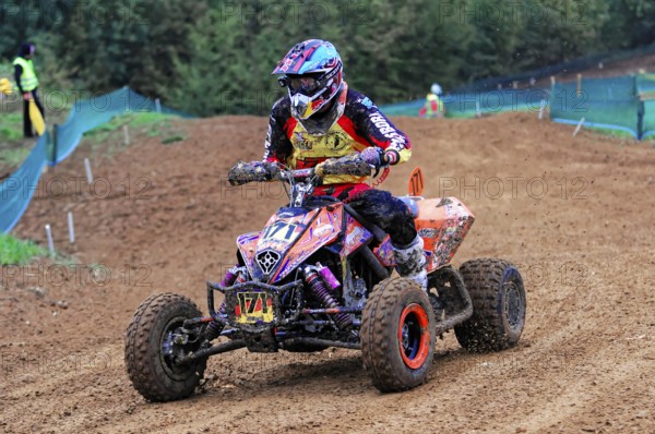 Motocross, Rudersberg, Baden-Württemberg, Germany, Europe, A quad rider masters the bend in the