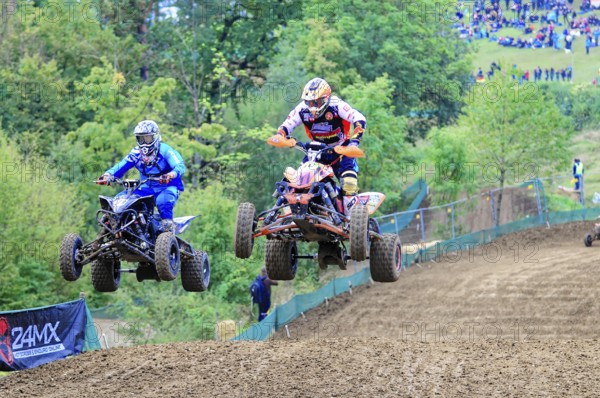 Motocross, Rudersberg, Baden-Württemberg, Germany, Europe, Two quads jump synchronised over a