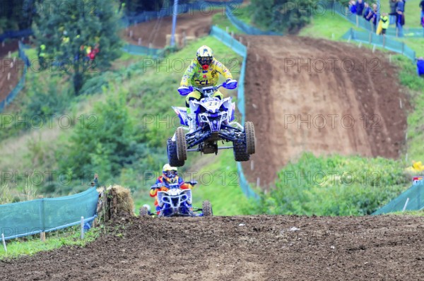 Motocross, Rudersberg, Baden-Württemberg, Germany, Europe, A quad bike rider jumps into the air on