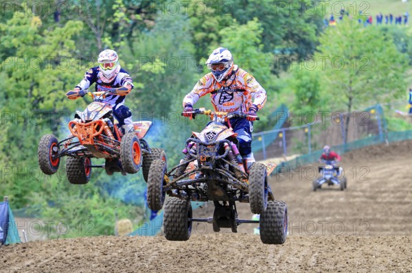 Motocross, Rudersberg, Baden-Württemberg, Germany, Europe, Two quad bikers jump side by side over a