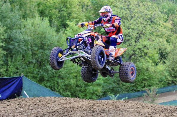 Motocross, Rudersberg, Baden-Württemberg, Germany, Europe, A quad bike rider takes off into the air