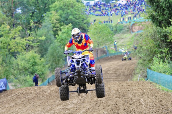 Motocross, Rudersberg, Baden-Württemberg, Germany, Europe, A quad bike rider jumps over a track,
