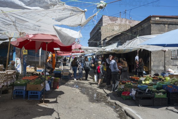 Lively outdoor market with many stalls and people under awnings, Gyumri, Giumri, Gyumri, Shirak