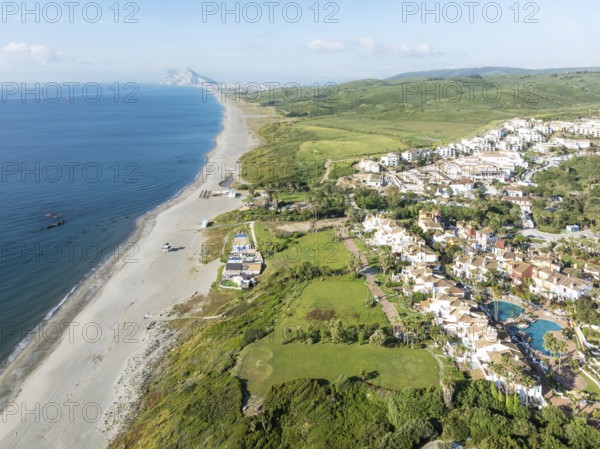 The La Alcaidesa urbanization at the Mediterranean Sea with the Rock of Gibraltar (British) in the
