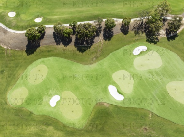 Driving range with greens and bunkers at the San Roque Club Golf Resort. Aerial view. Drone shot.