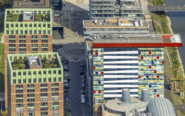 Aerial view, Colorium Hotel Innside Düsseldorf harbour and artistic coloured glass panel facade,