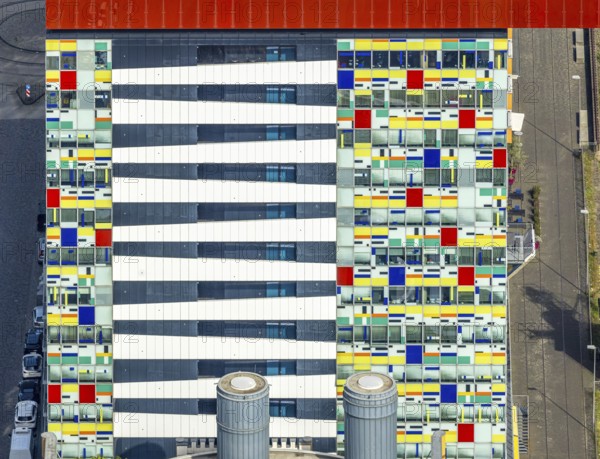 Aerial view, Colorium Hotel Innside Düsseldorf harbour and artistic coloured glass panel facade,