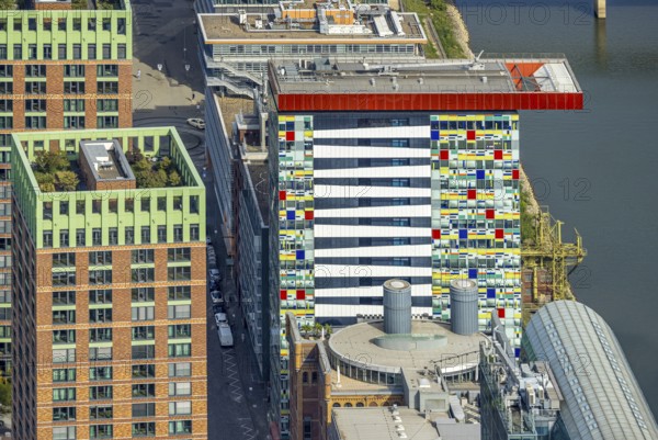 Aerial view, Colorium Hotel Innside Düsseldorf harbour and artistic coloured glass panel facade,