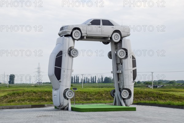 Homemade sculpture of three cars. Monument to the cyrillic letter P. Public Monument. Krasnodar,