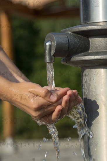 Catching Fresh And Cool Water And Cleaning Hands In An Artificial Spring, Austria