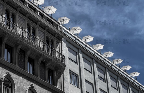 Roof Terrace With Sun Parasols On Historic And Modern Buildings In The Inner City Of Vienna In