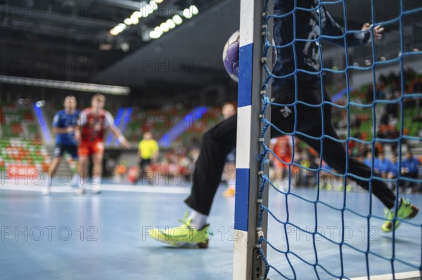 Detail of handball goal post when the ball hits it. Handball match in the background. handball.