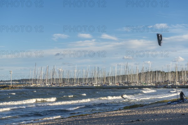 Kitesurfing in the Bay of Kiel in strong winds, high swell, Strande near Kiel,