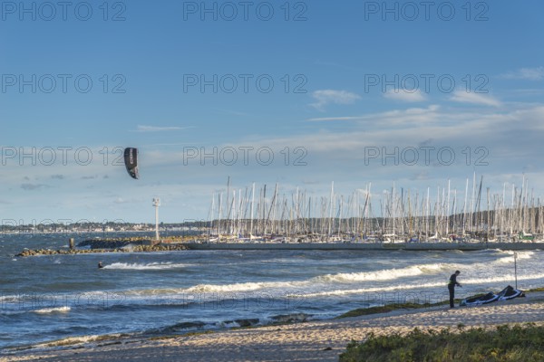 Kitesurfing in the Bay of Kiel in strong winds, high swell, Strande near Kiel,