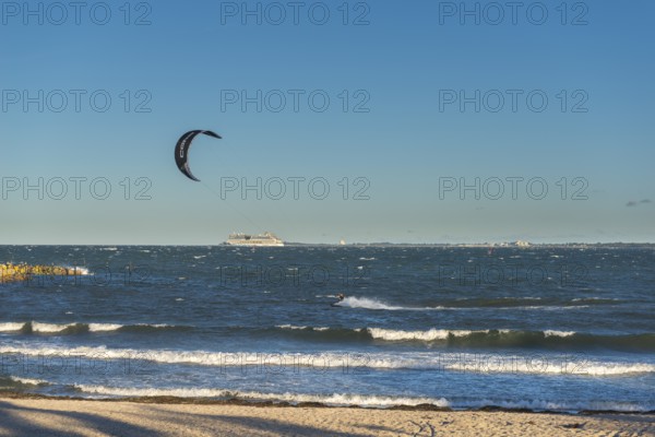 Kitesurfing in the Bay of Kiel in strong winds, high swell, Strande near Kiel,