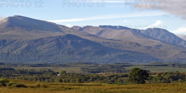 Vast mountain landscape with wooded hills and clear skies, Highlands, Ben Nevis, Scotland, Great