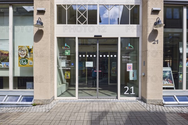 Townhouse, pedestrian zone, building, facade with windows, entrance area, citizens' office, city