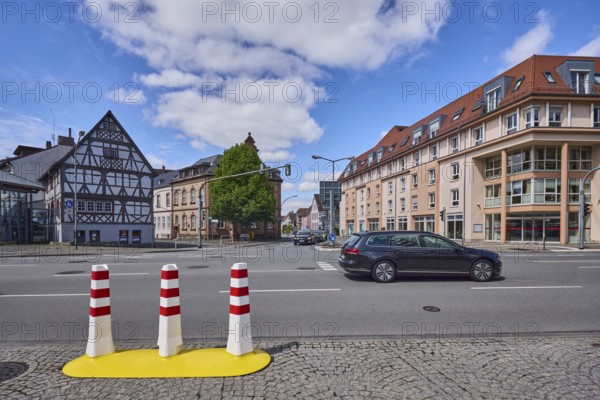 Half-timbered house, general architecture, traffic light crossing, bollards, pavement made of
