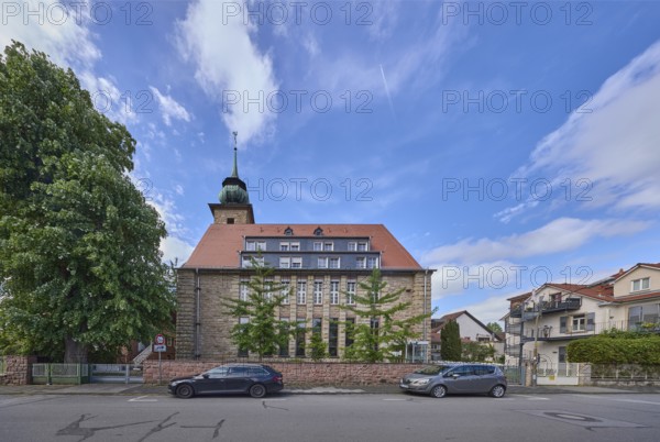 Chapel of the mother house St. Vinzent, general architecture, car park with vehicles, trees, blue