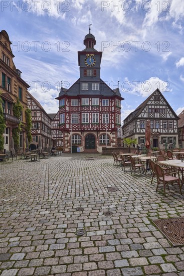 Historic town hall, old town, square, half-timbered houses, tower clock, cobblestone pavement,