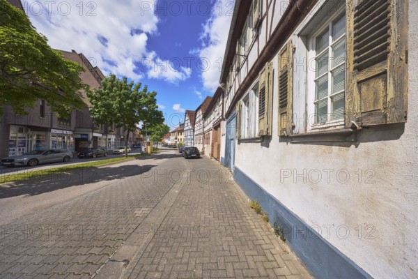 Historic half-timbered houses, general architecture, street, car park with vehicles, facade with
