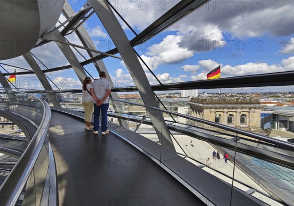 Interior view of the Reichstag dome with visitors and German flags, Reichstag building, government