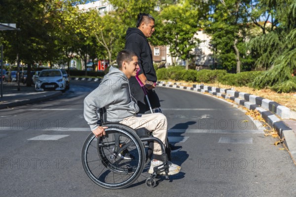 Two diverse young individuals with disabilities walking on a city road, one person using a