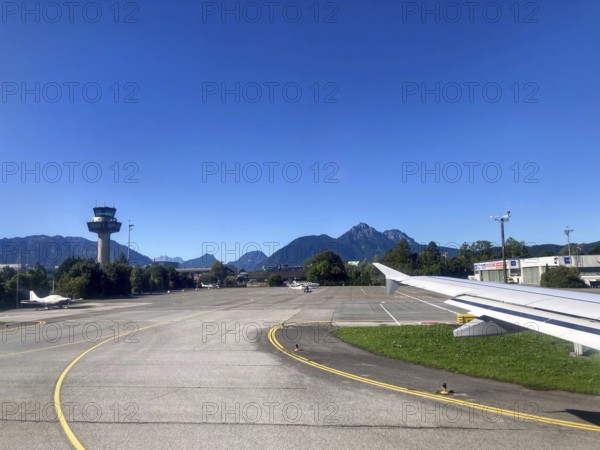 View of the tower and the Hochstaufen, Salzburger Land, Austria, from the aircraft on take-off from