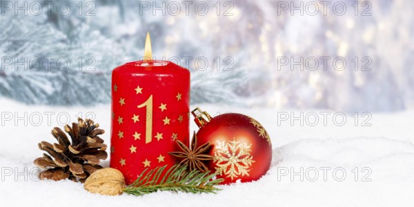 First 1st Advent candle for Christmas Christmas card in winter with text free space Copyspace