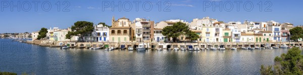 Colourful houses in Portocolom Fishing village on Majorca Panorama with boats Holiday by the sea