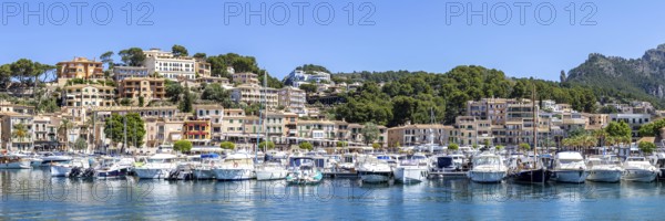 Port de Soller town on Majorca holiday by the sea yacht harbour with boats panoramic trip in Port