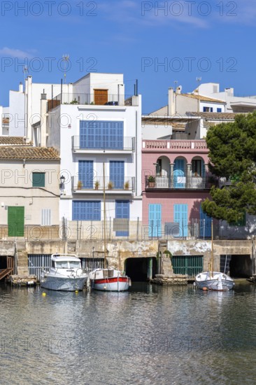 Colourful houses in Portocolom Fishing village on Majorca with boats Seaside holiday in Portocolom,