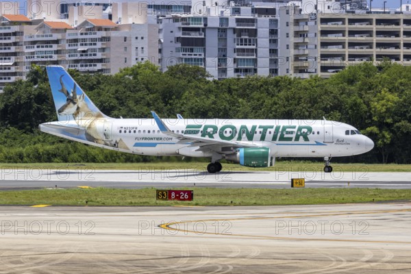 A Frontier Airlines Airbus A320 aircraft with the registration number N233FR at San Juan Airport,