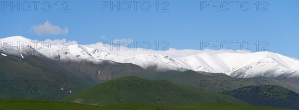 Snow-covered mountain range under a clear blue sky, landscape near Saratovka, Lesser Caucasus,