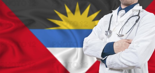 Antigua and Barbuda healthcare concept. Male doctor on Antigua and Barbuda flag. Doctor with