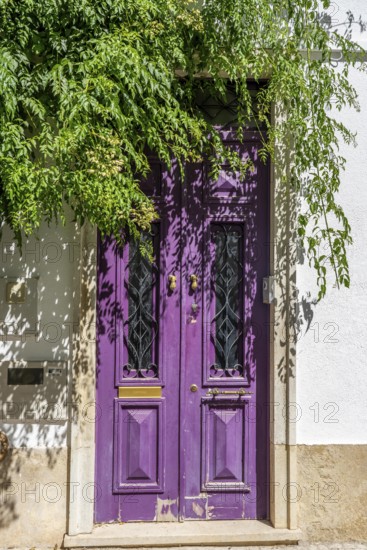 The old town centre of Tavira, typical door knockers found on many wooden doors in the town,