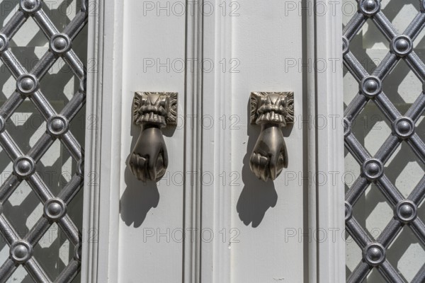The old town centre of Tavira, typical door knockers found on many wooden doors in the town,