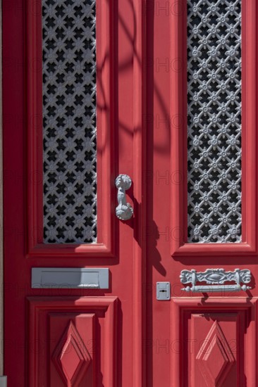 The old town centre of Tavira, typical door knockers found on many wooden doors in the town,