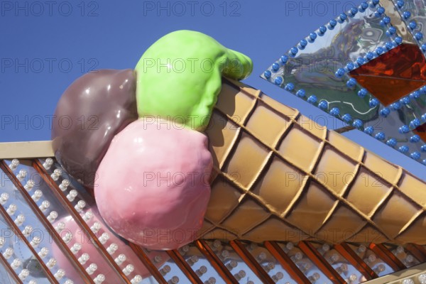 Ice cream cone with colourful ice cream scoops as decoration at the Bremer Osterwiese folk