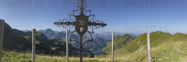 Forged memorial cross for Josef Böck, master shepherd of the rear Seealpe, behind it mountain