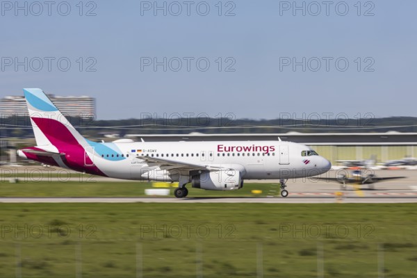 Stuttgart Airport with aircraft on the runway. Aircraft registration number: D-AGWV, Eurowings,