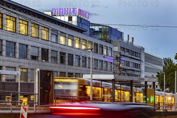 Headquarters of the automotive supplier MAHLE in the evening with the SSB tram. Bad Cannstatt,