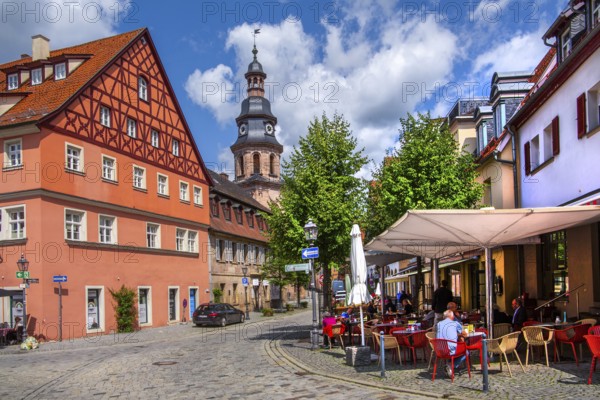 Half-timbered house with street café and hospital church in the old town, beer town Kulmbach,